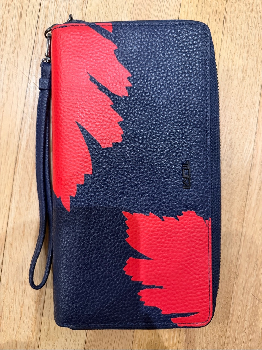 Tumi Navy Leather passport wallet wristlet with red flower print